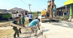 Read more about the article Mengukir Asa di Kesongo: Sinergi Satgas TMMD 129 Bojonegoro dan Warga Bangun Drainase 330 Meter Bebas Genangan